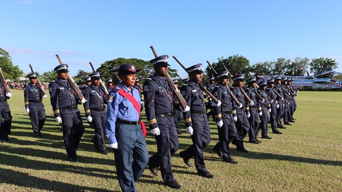 A police unit from PNG march in formation.