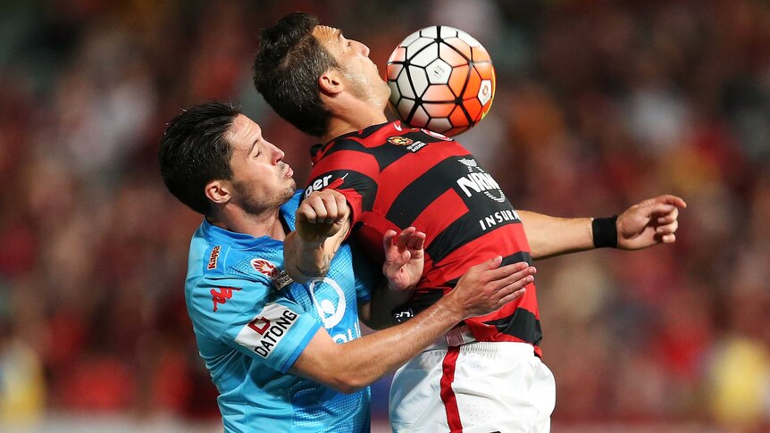 Federico Piovaccari of the Wanderers competes with Dylan McGowan of Adelaide