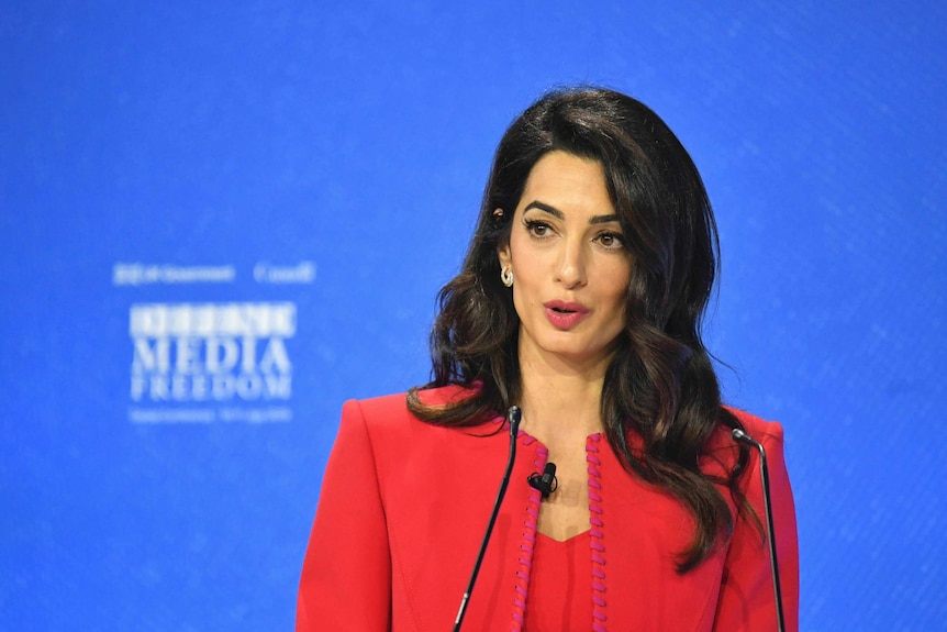 Amal Clooney speaks at a conference in London