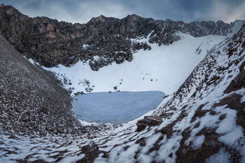 Roopkund Lake seen from atop its Himalayan crater.