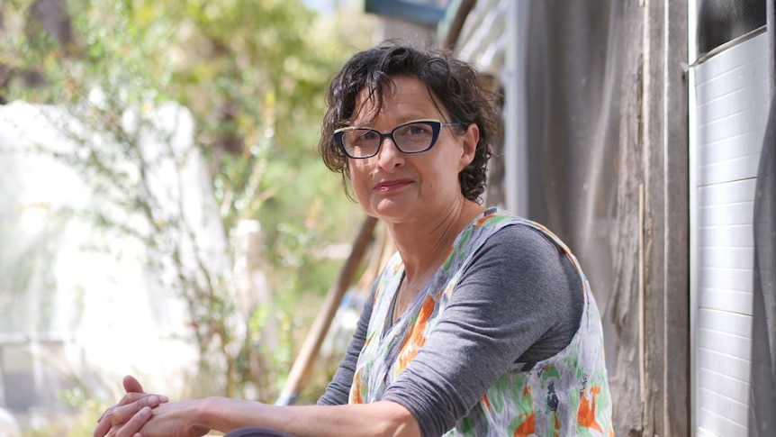 Daniela Casotti sits on her back steps