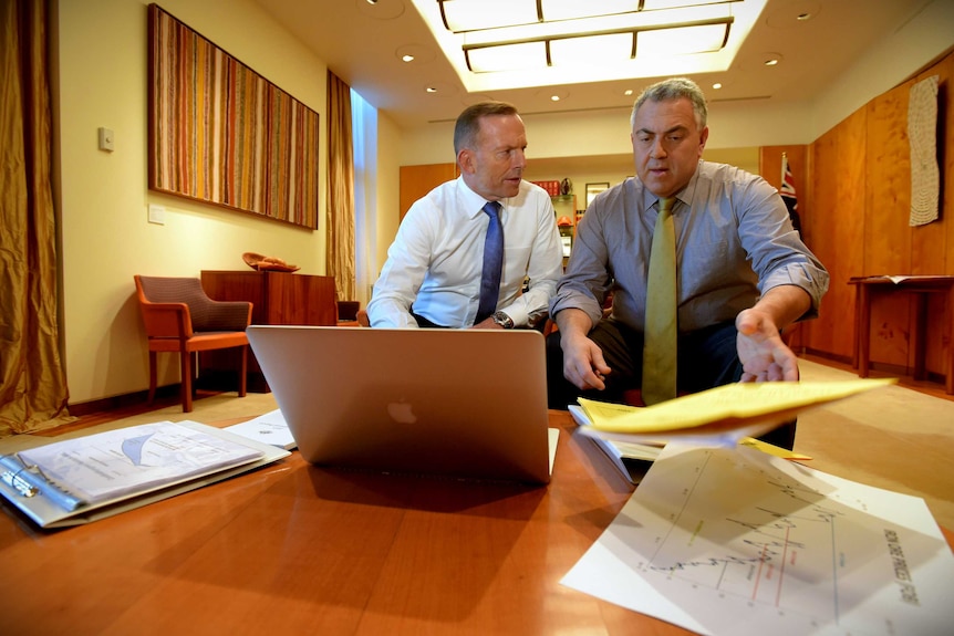 Then-prime minister Tony Abbott  and treasurer Joe Hockey pose for 2015 budget pictures