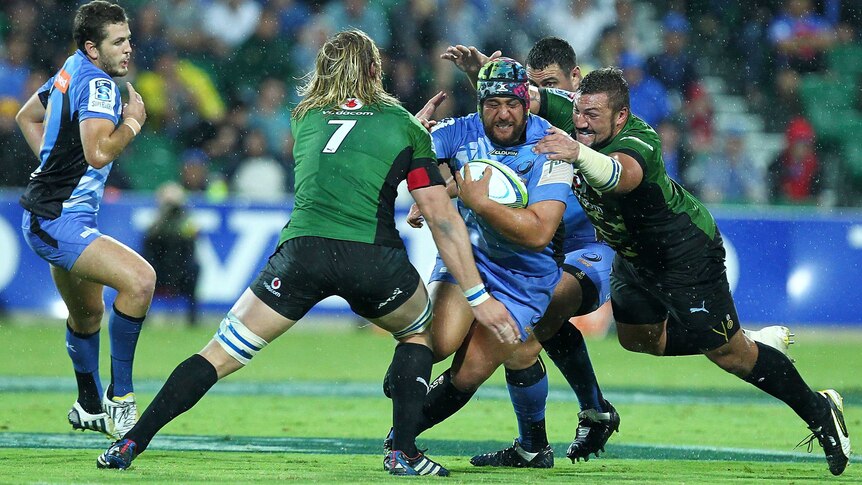 The Western Force's Pek Cowan is tackled by the Bulls defence at Perth Oval.