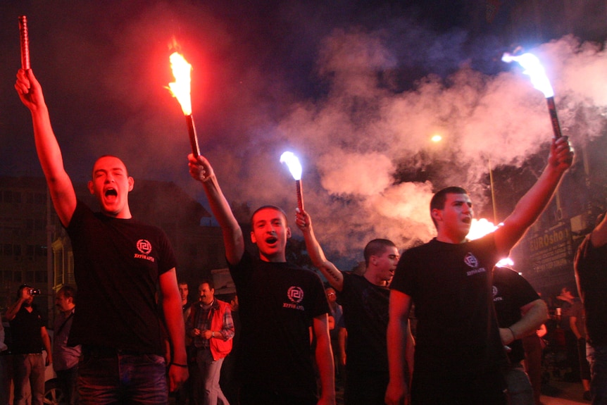 Members of Greek extreme Right Wing Golden Dawn Party celebrate their party's return to parliament
