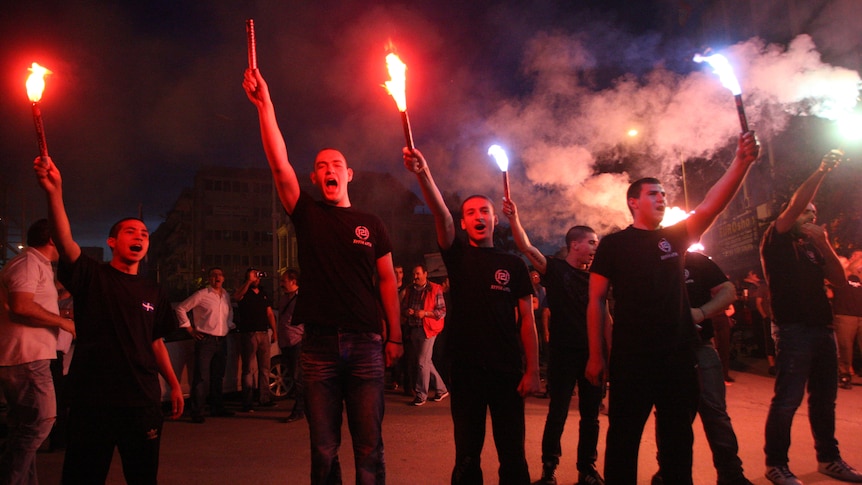 Members of Greek extreme Right Wing Golden Dawn Party celebrate their party's return to parliament