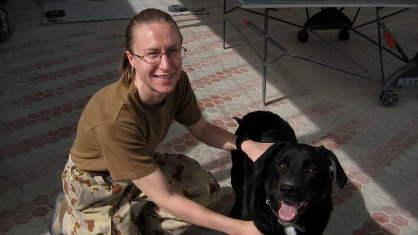 Sally Heidenreich with a military working dog named Sarbi in Afghanistan in 2009.