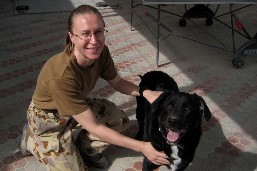 Sally Heidenreich with a military working dog named Sarbi in Afghanistan in 2009.