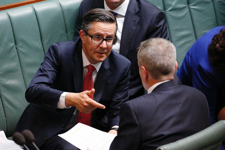 Shadow Energy Minister Mark Butler chats with Opposition Leader Bill Shorten during Question Time, pointing with his finger