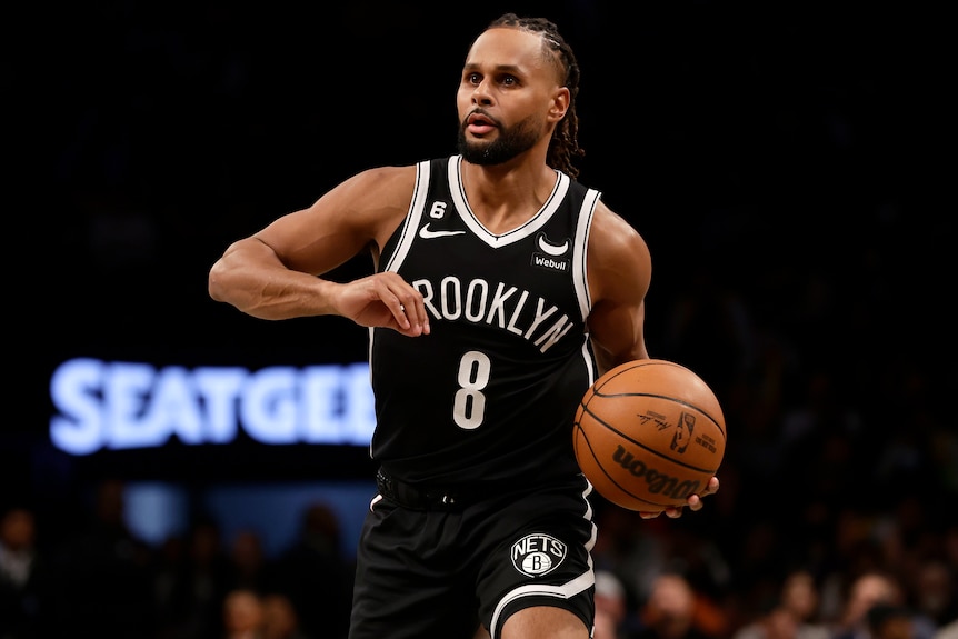 Patty Mills dribbles the ball during an NBA game for the Brooklyn Nets in 2023.