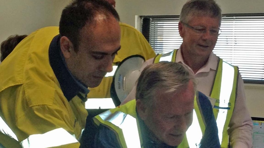 Colin Barnett presses button at desal plant