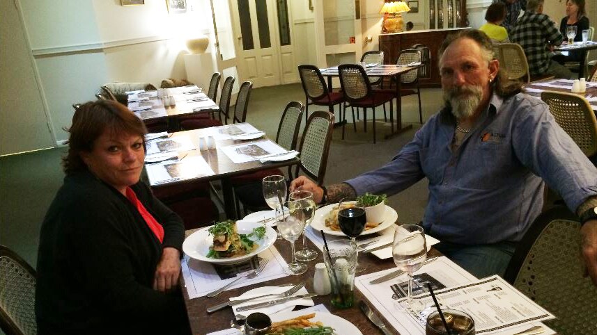Jonda Stephen and her partner Chris Tiffin sitting at a dining table at a restaurant