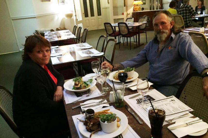 Jonda Stephen and her partner Chris Tiffin sitting at a dining table at a restaurant