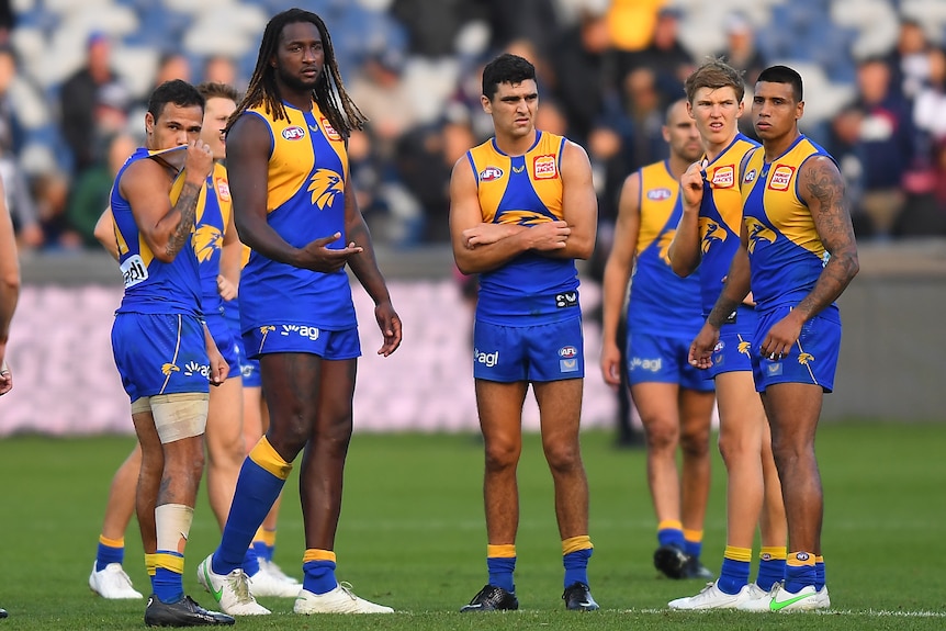 Jamaine Jones, Nic Naitanui, Tom Cole, Brayden Ainsworth and Tim Kelly look dejected on the field after a loss