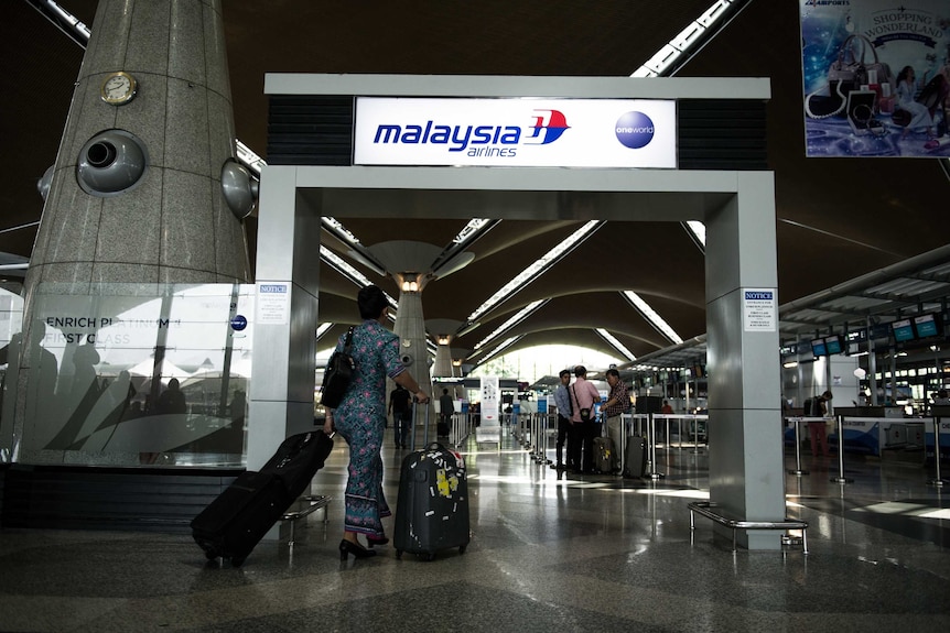 Malaysia Airlines attendant at KL airport