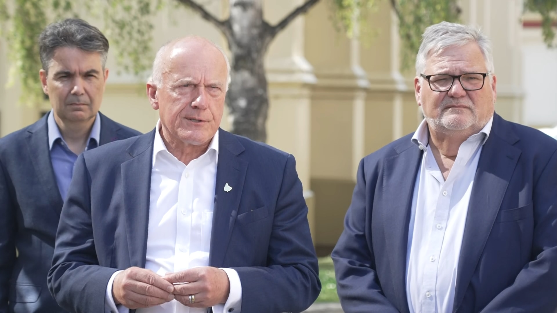 Eric Abetz and TT-Line Ken Kanofski two late middle-aged men in suits speaking to the camera