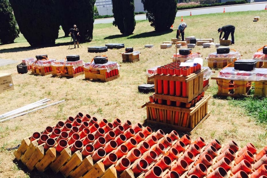 Pyrotechnicians prepare for Canberra New Year's Eve fireworks.