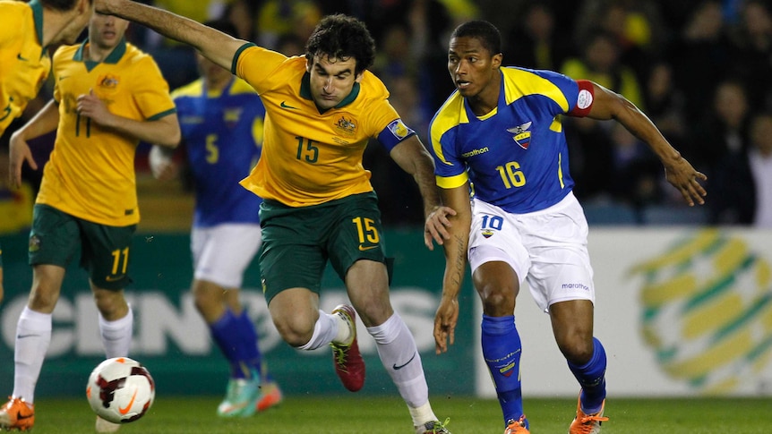 Jedinak battles against Ecuador midfield