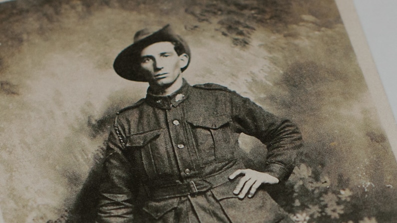 Copy of an old black and white photograph of a man in army uniform.