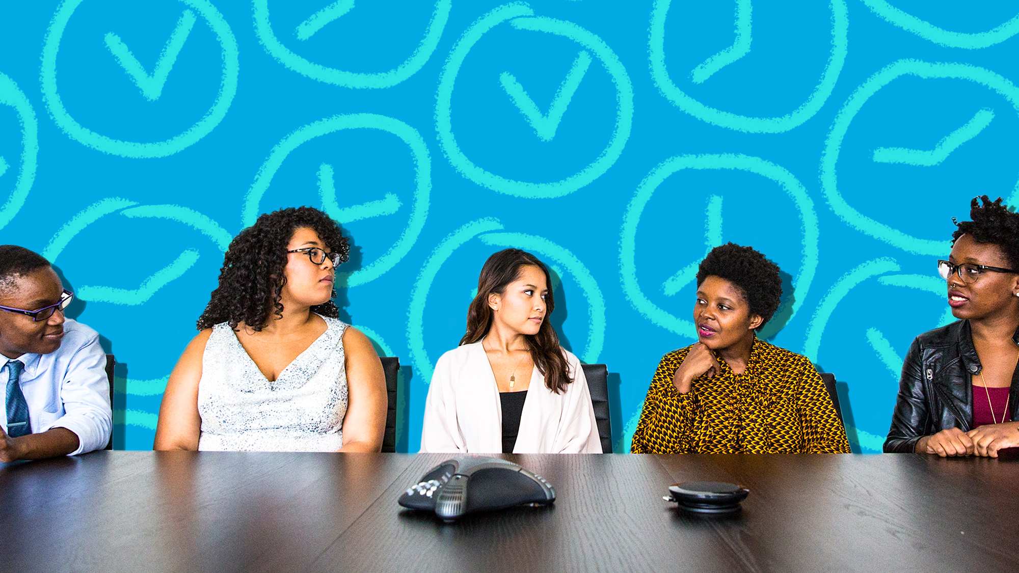 Five people sit next to each other at a conference table for a business meeting to depict how to make meetings more productive