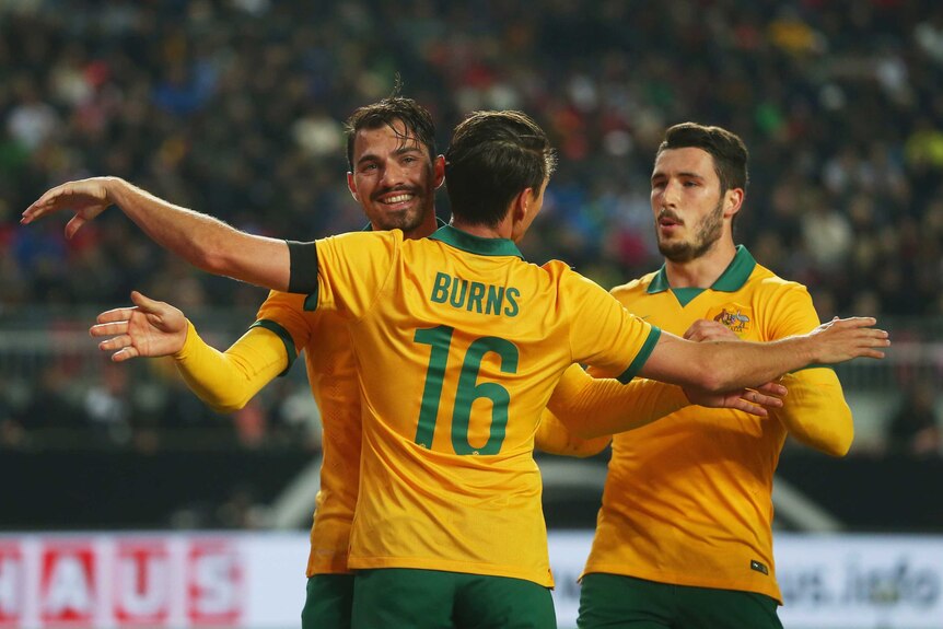 On target ... James Troisi (L) celebrates with team-mate Nathan Burns