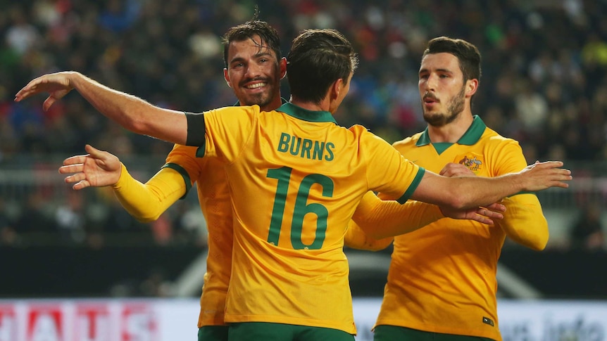 On target ... James Troisi (L) celebrates with team-mate Nathan Burns