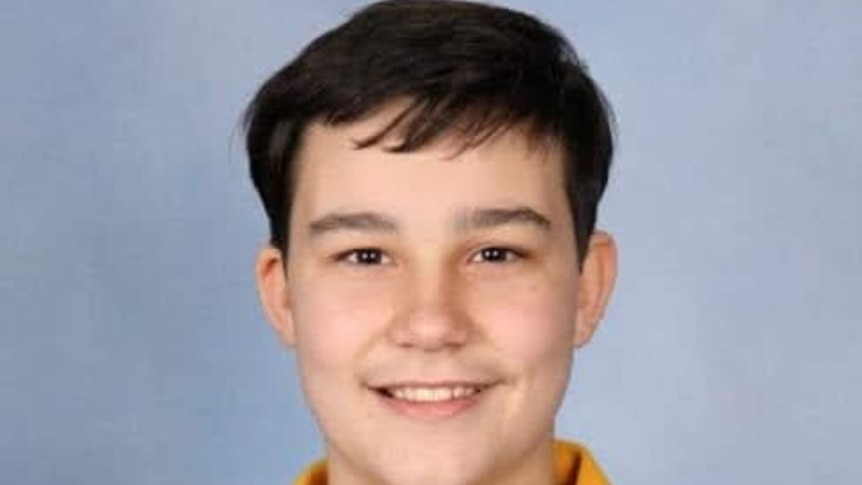 Teenage boy in a school uniform.