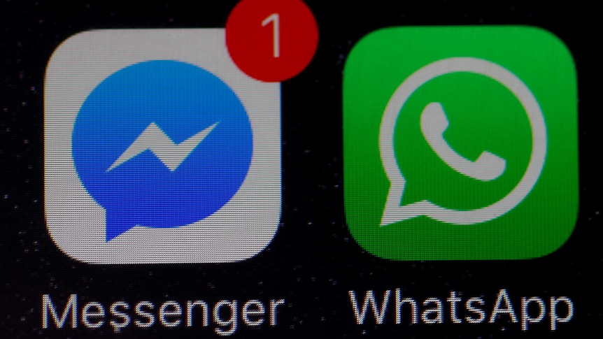 WhatsApp and Facebook messenger icons on an iPhone