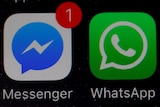 WhatsApp and Facebook messenger icons on an iPhone