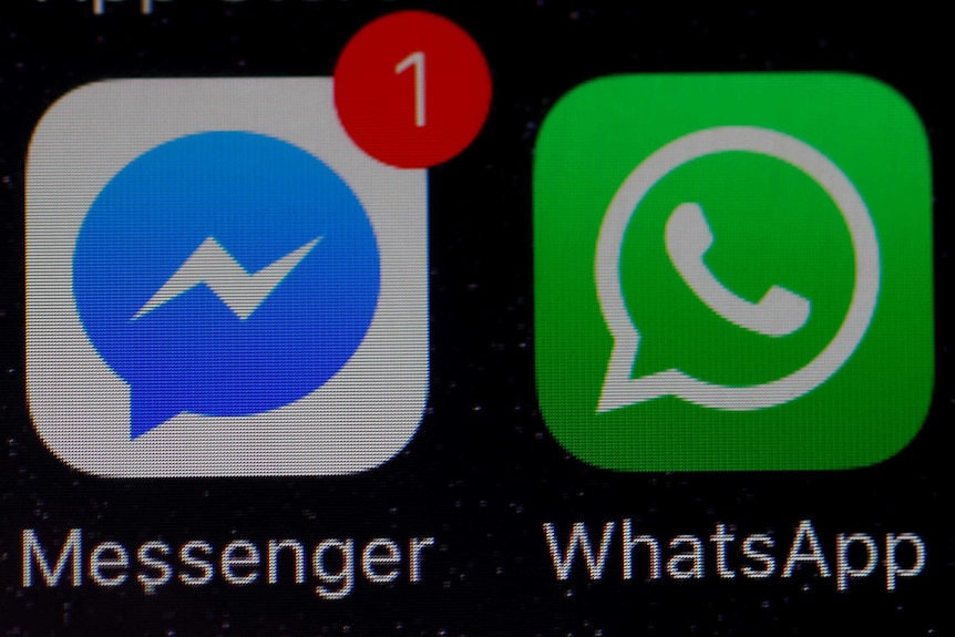 WhatsApp and Facebook messenger icons on an iPhone