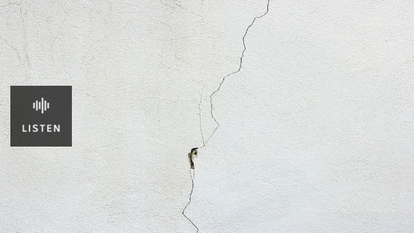 Photo of a crack in a white wall. Has Audio.