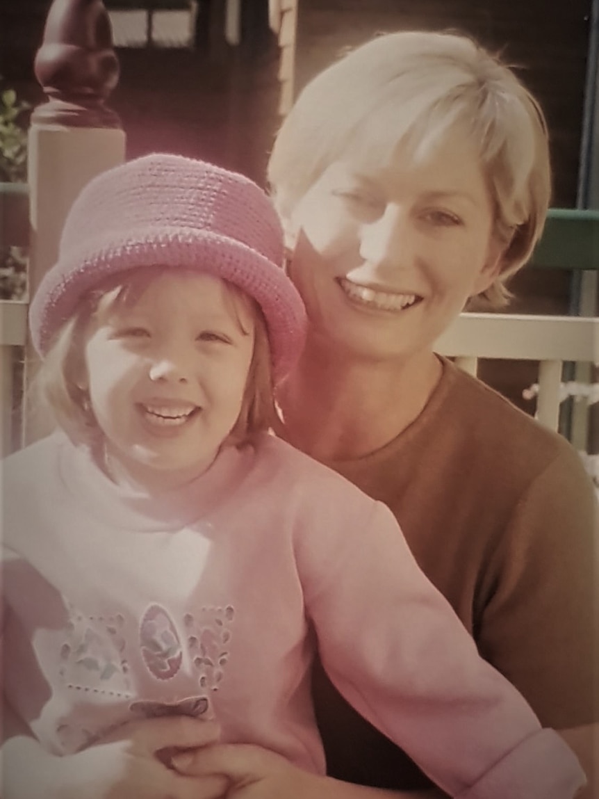 An old photo of a young woman and her daughter.