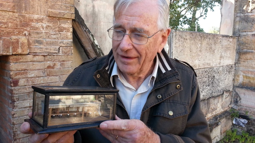 Benno Glockemann with model of German internment camp at Holsworthy