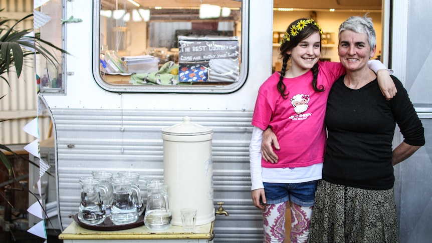 Cafe owner and vegan Caithlin Meave and her daughter Iskhar outside their caravan cafe.