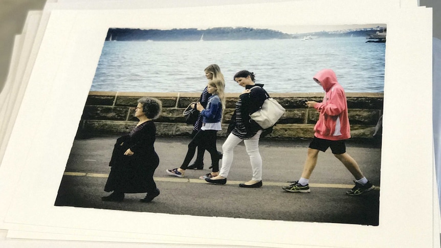 Debra Keenhan walking along with a woman looking down on her.