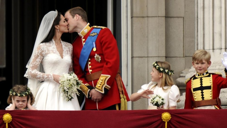 The Duke and Duchess of Cambridge kiss on the balcony of Buckingham Palace