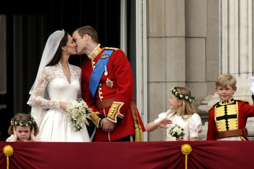 The Duke and Duchess of Cambridge kiss on the balcony of Buckingham Palace