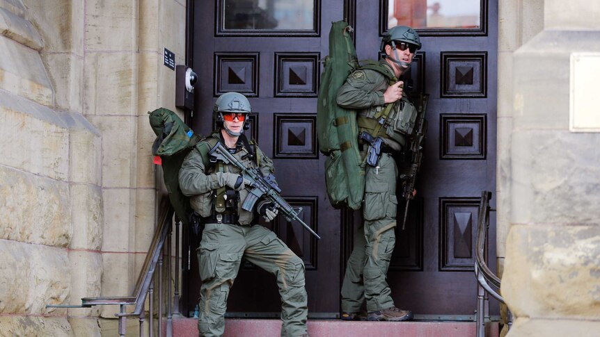 Canada shooting. Armed police outside Canada's parliament building after a gunman entered the building and fired shots