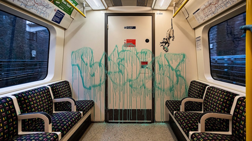 Banksy's latest work sprayed on the inside of a London Underground tube carriage.