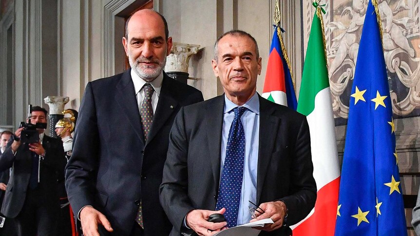 Carlo Cottarelli, right, stands next to Italian President Sergio Mattarella.