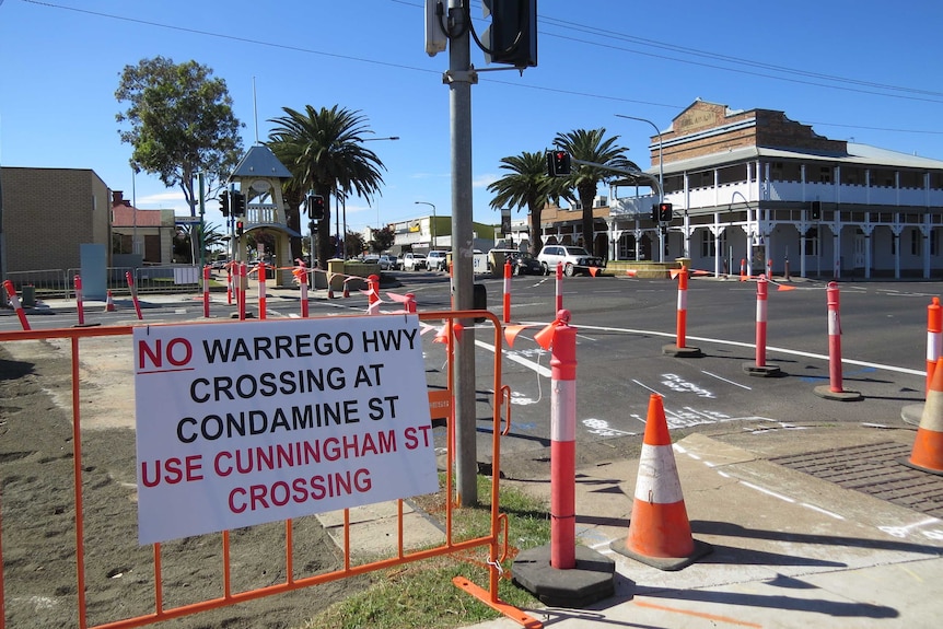 Road works signs at the intersection, with the Dalby sign in the background.