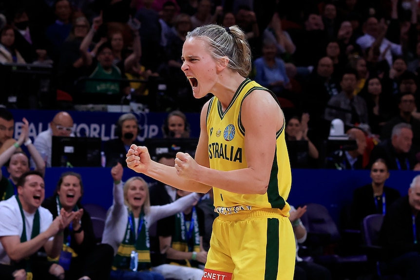 Australian basketballer Kristy Wallace is screaming with delight, both fists pumped