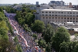 People march during an anti-government protest in Warsaw