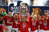 We are the champions... Manchester United's Ryan Giggs lifts the EPL title for a second successive season.