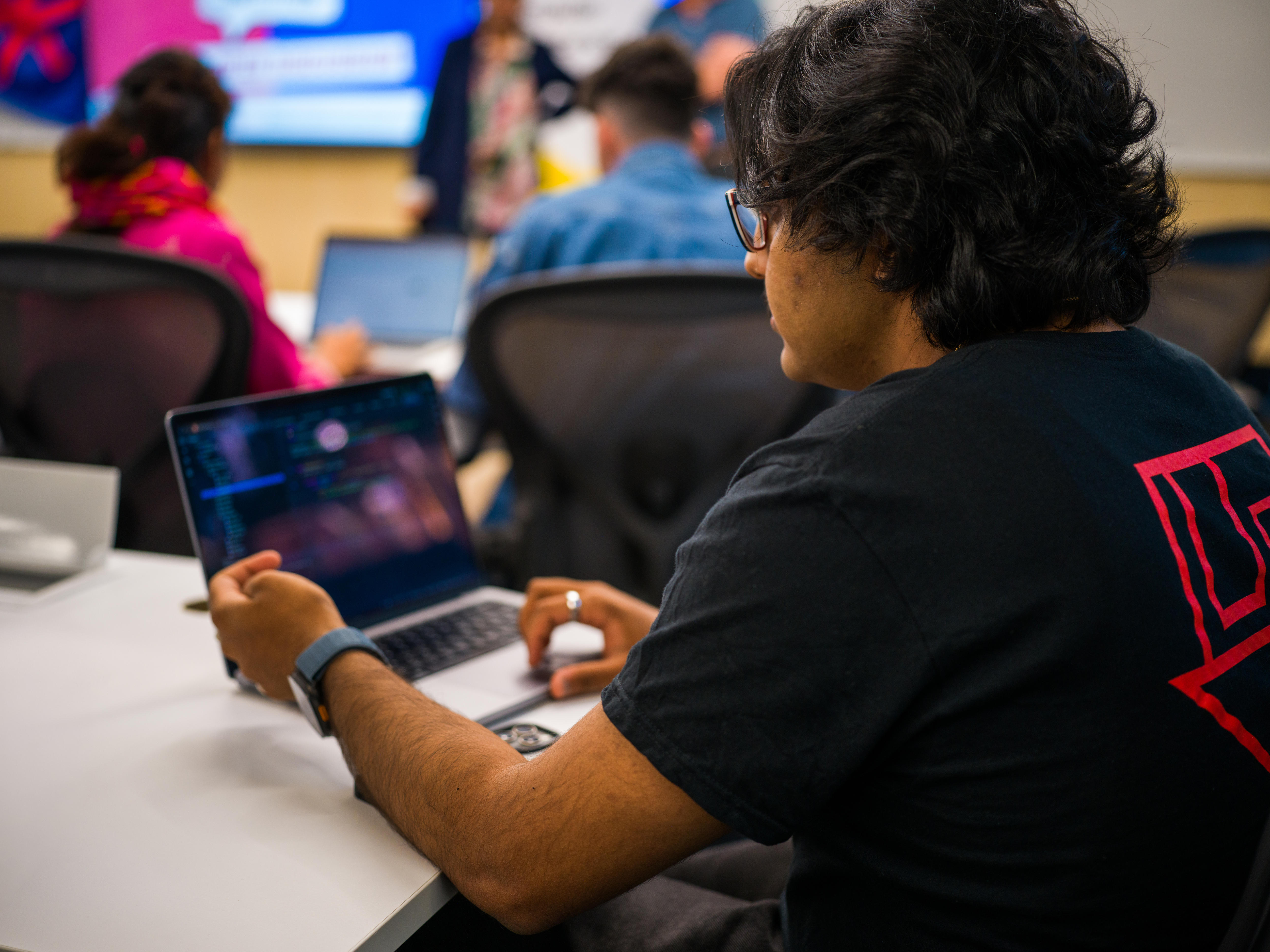 A uni student on a laptop.