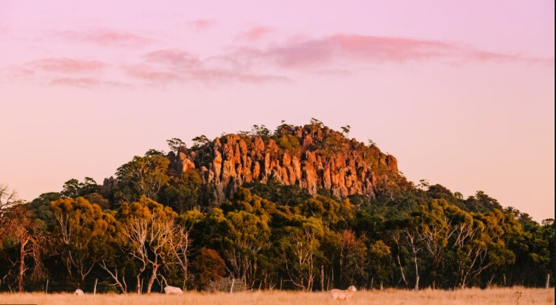 Hanging Rock in Victoria with the sun turning the rock orangey pink