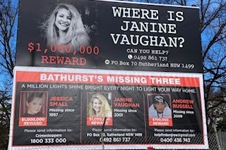 A billboard featuring three people missing in Bathurst, including Janine Vaughan