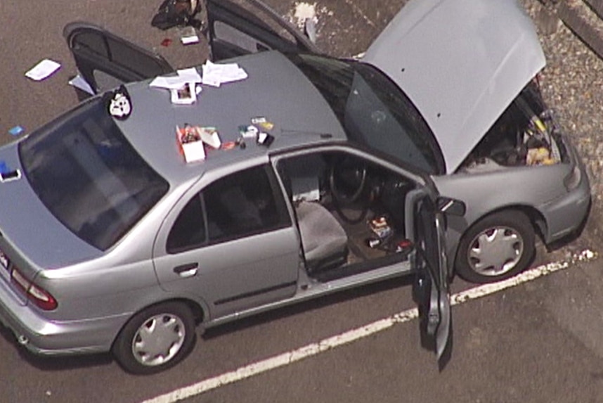 Aerial vision of a car that police found an explosive device in at Redbank Plaza, west of Ipswich on April 4, 2018.