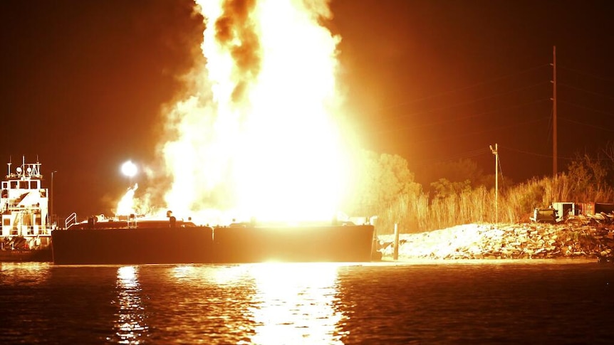 A barge explodes on the Mobile River in Alabama