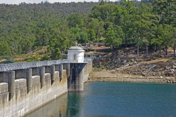 Concrete dam wall with low water levels, at Mundaring, Western Australia