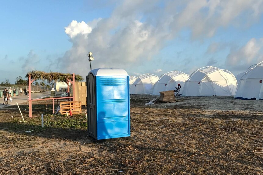 Tents and a portable toilet at Fyre Festival